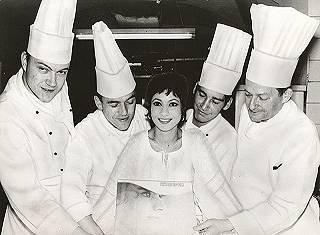 Esther Ofarim surrounded by cooks